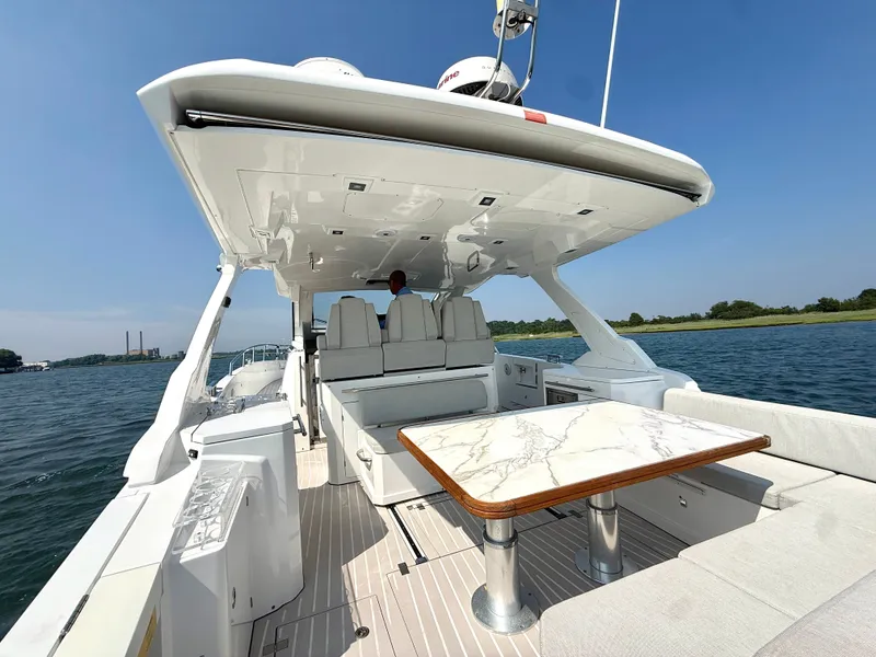 Slide: The Image of The image shows the deck of a 2019 Azimut Verve 40 with a sleek marble table. - 4