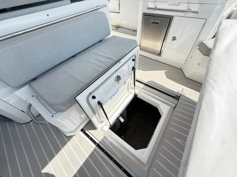 Slide: The Image of The image shows access to a storage compartment on a 2019 Azimut Verve 40 boat. - 14