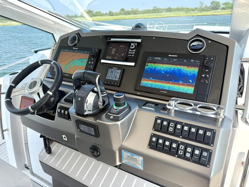 Slide: The Image of The image shows the helm of a 2019 Azimut Verve 40 with modern navigation systems. - 17