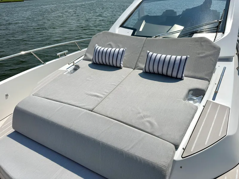 Slide: The Image of The 2019 Azimut Verve 40 features a sleek sun deck with striped cushions. - 19