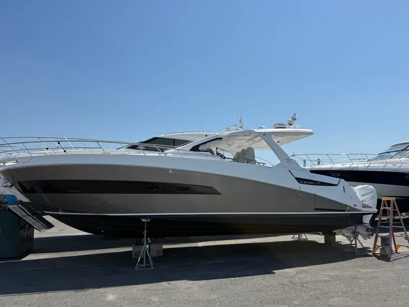 Slide: The Image of The 2019 Azimut Verve 40 is on a dry dock. It features a sleek, modern design. - 2