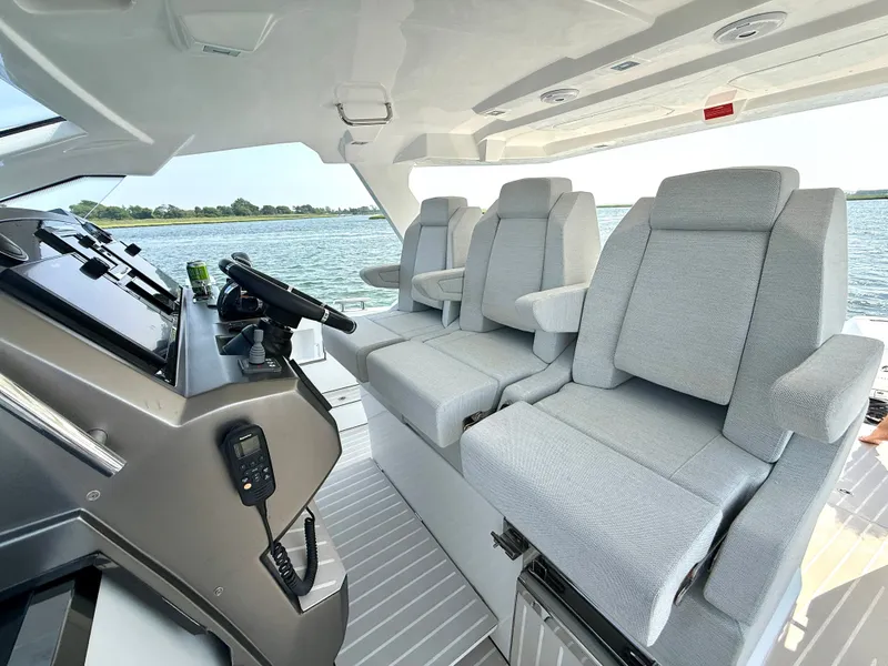 Slide: The Image of The image shows the cockpit of a 2019 Azimut Verve 40 with gray seats and a helm station. - 16