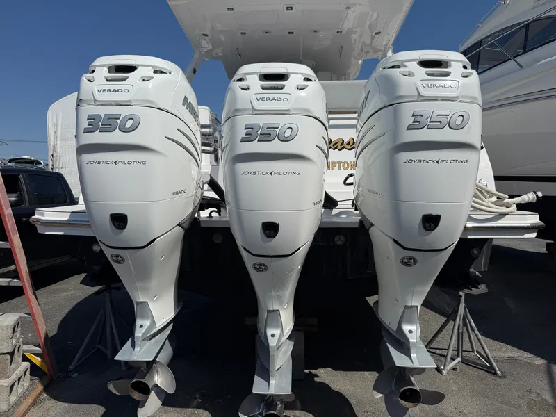 Slide: The Image of Three powerful outboard engines labeled "350 Verado" are mounted on the stern of a boat. - 26