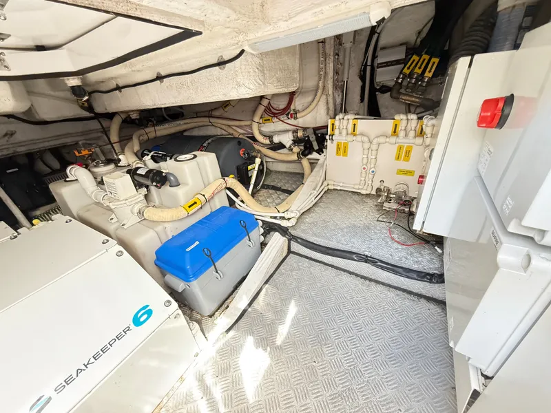 Slide: The Image of The engine room of a 2019 Azimut Verve 40 shows technical equipment and wiring. - 38