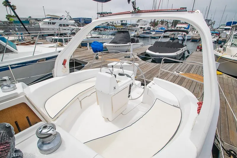 Slide: The Image of Cockpit view of a 1999 Hunter 340 sailboat docked at a marina. - 29