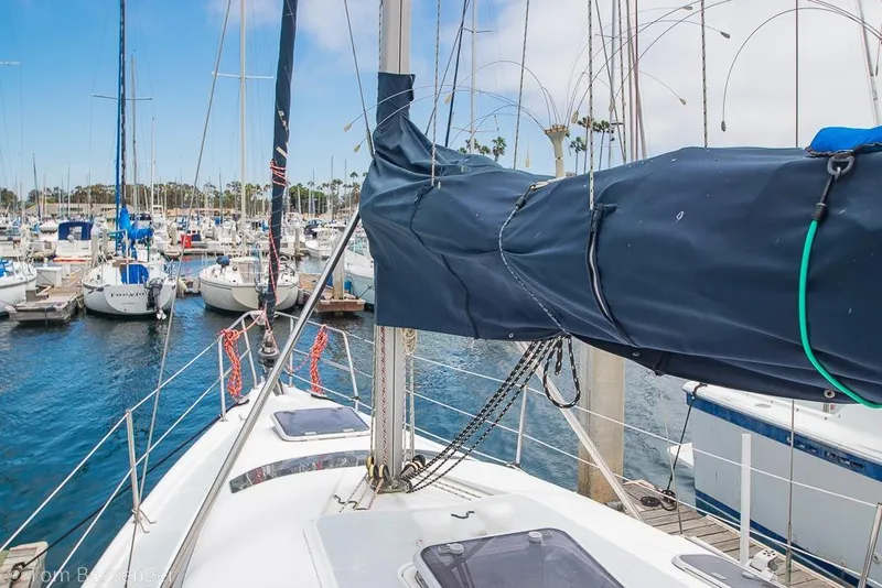 Slide: The Image of Sailboat Hunter 340, 1999 model, docked in a marina with other boats. - 31