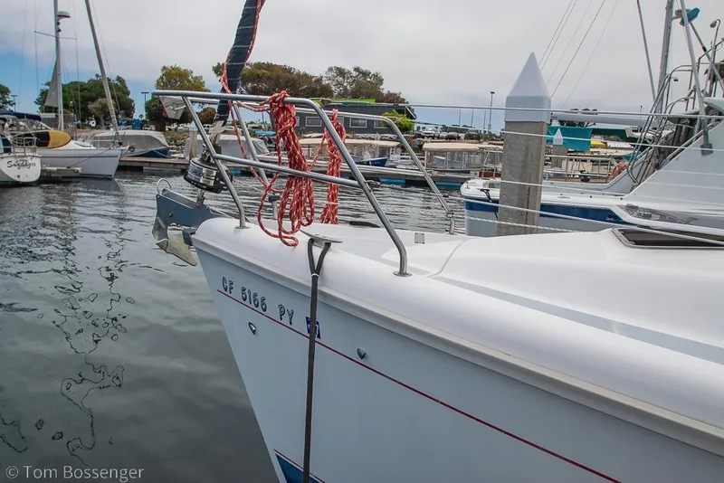 Slide: The Image of Sailboat docked at marina, Hunter 340 model, 1999, with red ropes on deck. - 4