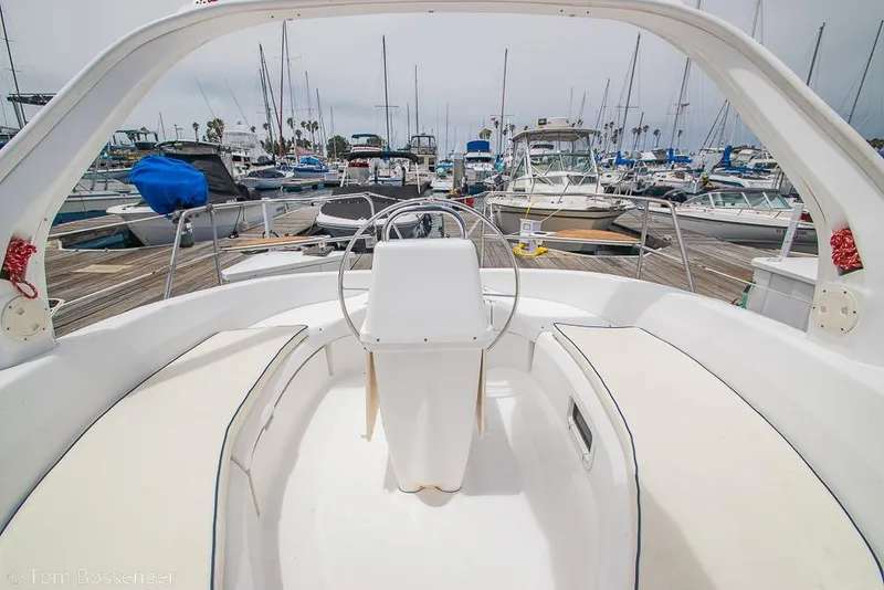 Slide: The Image of Cockpit view of a 1999 Hunter 340 sailboat docked in a marina. - 24