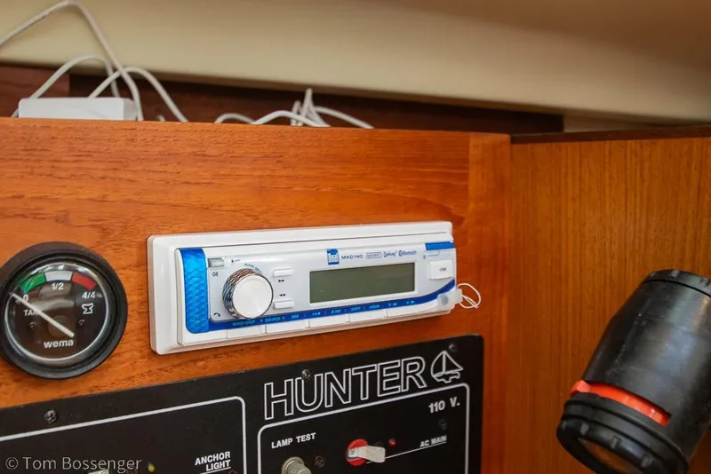 Slide: The Image of Control panel of a 1999 Hunter 340 sailboat with stereo and gauge. - 22