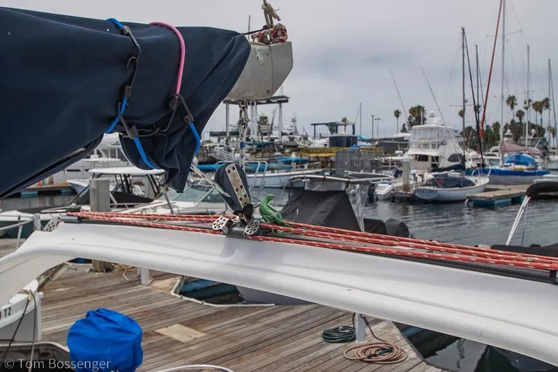 Slide: The Image of Sailboat rigging on a 1999 Hunter 340 at a marina with various boats. - 30