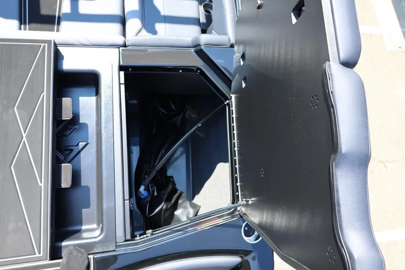 Slide: The Image of The image shows a storage compartment in a 2027 ATX Surf Boat 22 Type-S. - 20
