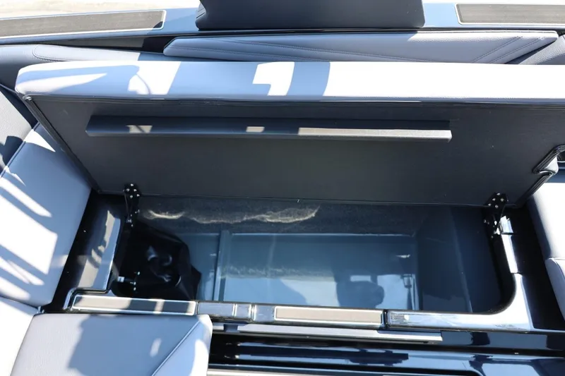 Slide: The Image of An open storage compartment in an ATX Surf Boat, model 22 Type-S, year 2027. - 31