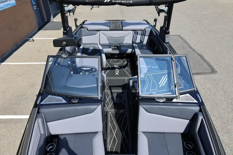Slide: The Image of The image shows the interior of a 2027 ATX Surf Boats 22 Type-S with gray seating and modern design. - 48