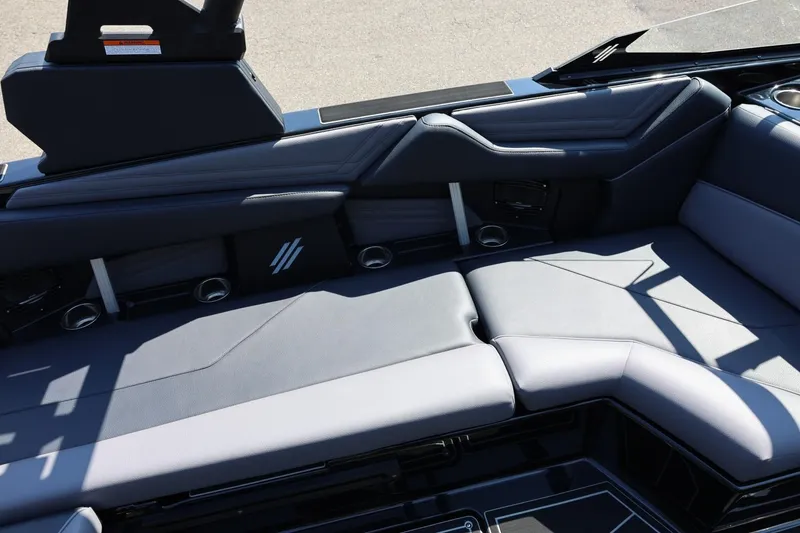 Slide: The Image of The image shows the luxurious interior of an ATX Surf Boats 22 Type-S with gray upholstery. - 26