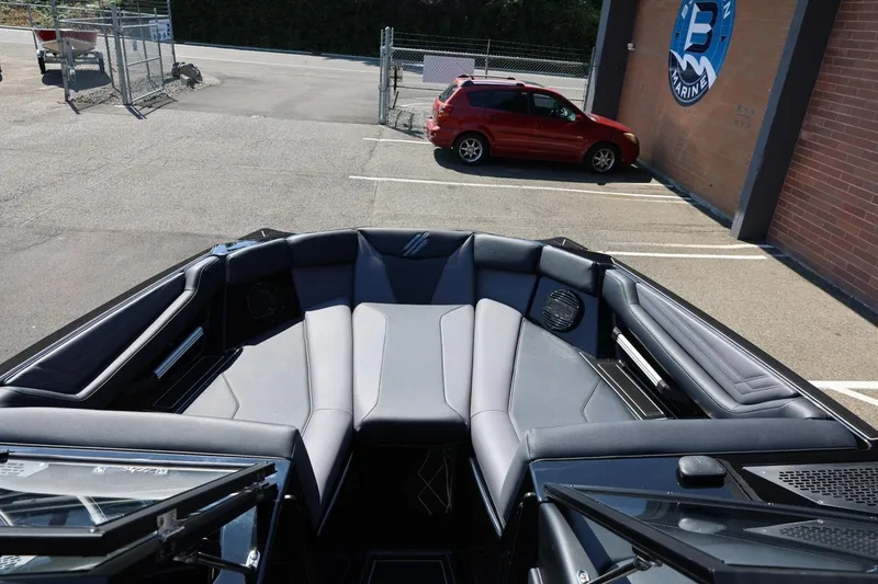 Slide: The Image of The image shows the bow of a 2027 ATX Surf Boats 22 Type-S with luxurious black upholstery. - 40
