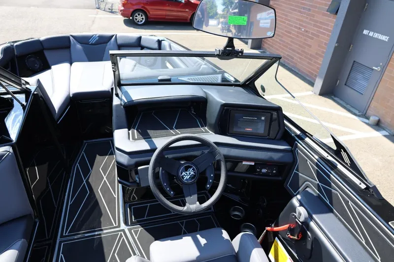 Slide: The Image of The cockpit of a 2027 ATX Surf Boats 22 Type-S with a modern dashboard and steering wheel. - 34