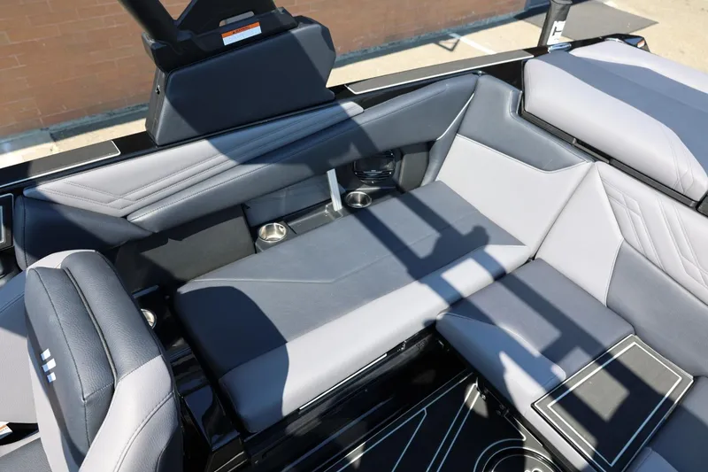 Slide: The Image of The image shows the interior of a 2027 ATX Surf Boats 22 Type-S with gray upholstery. - 29