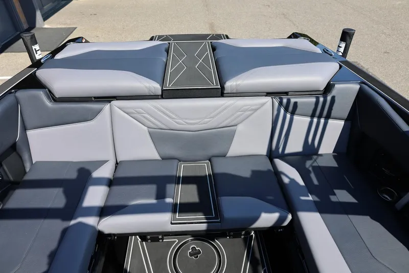 Slide: The Image of The image shows the stylish, cushioned stern of a 2027 ATX Surf Boats 22 Type-S. - 28