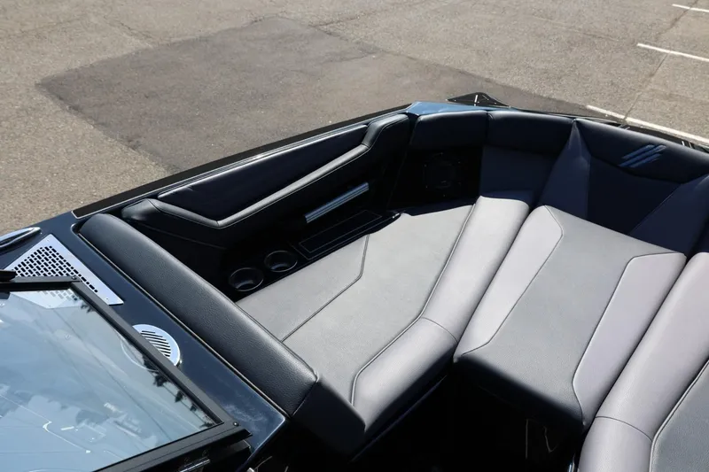 Slide: The Image of The image shows the bow area of an ATX Surf Boats 22 Type-S with gray upholstery and cup holders. - 41