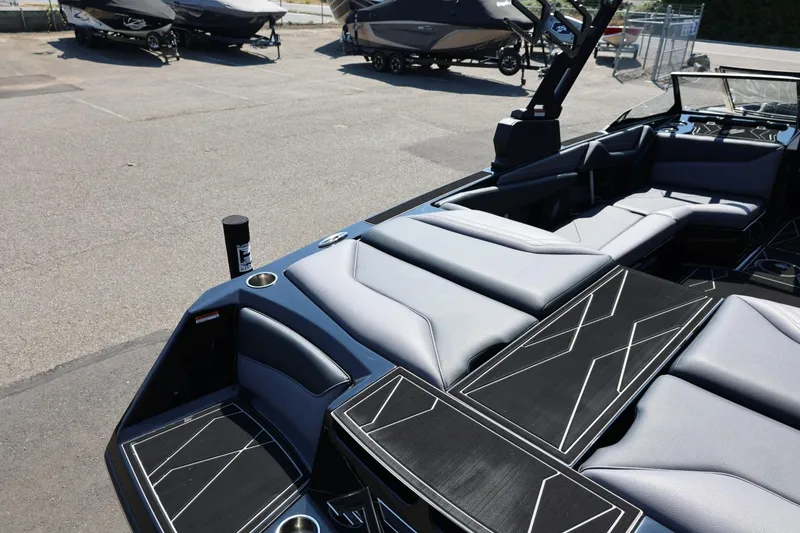 Slide: The Image of The image shows the deck of a 2027 ATX Surf Boats 22 Type-S with gray upholstery. - 16