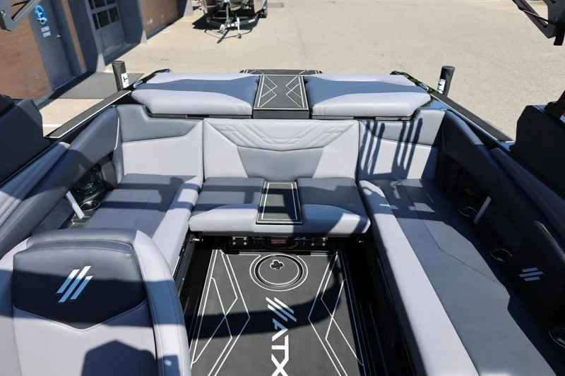 Slide: The Image of The image shows the stylish cockpit of an ATX Surf Boats 22 Type-S with gray upholstery. - 50