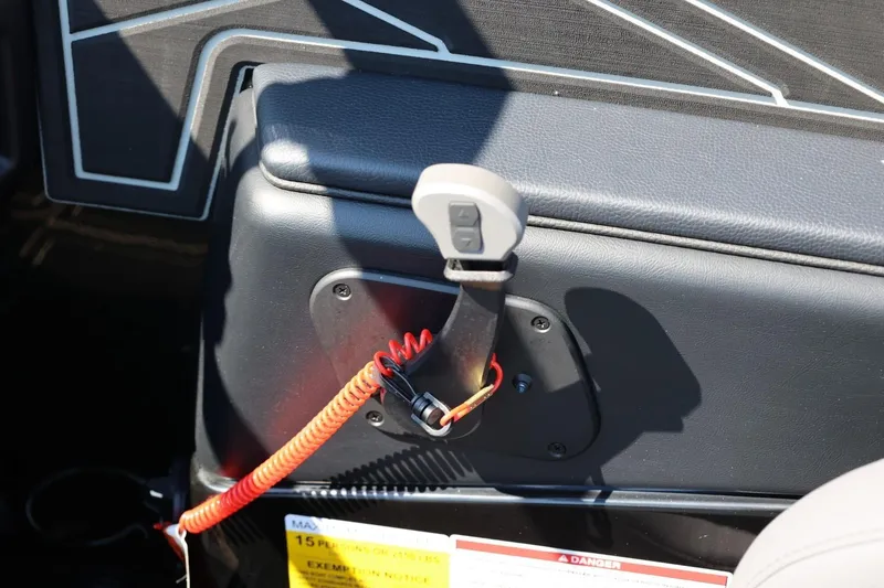 Slide: The Image of Close-up of a boat throttle with a red safety lanyard. - 36