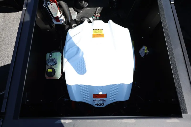 Slide: The Image of The engine compartment of a 2027 ATX Surf Boats 22 Type-S with a white engine block. - 24