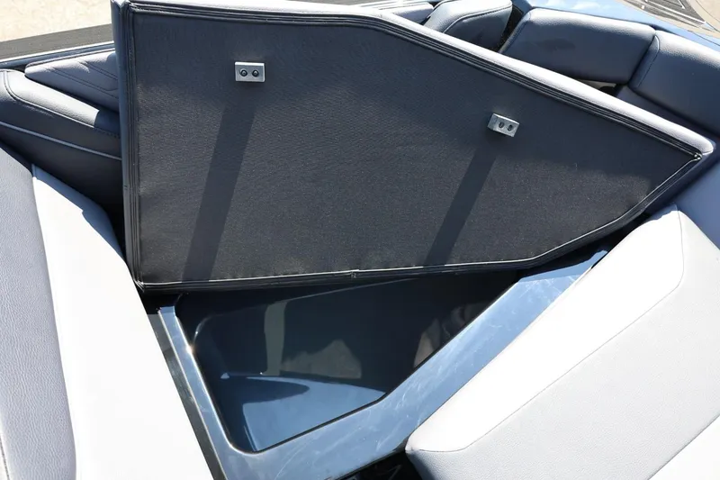 Slide: The Image of The image shows an open storage compartment in an ATX Surf Boat, model 22 Type-S, year 2027. - 46