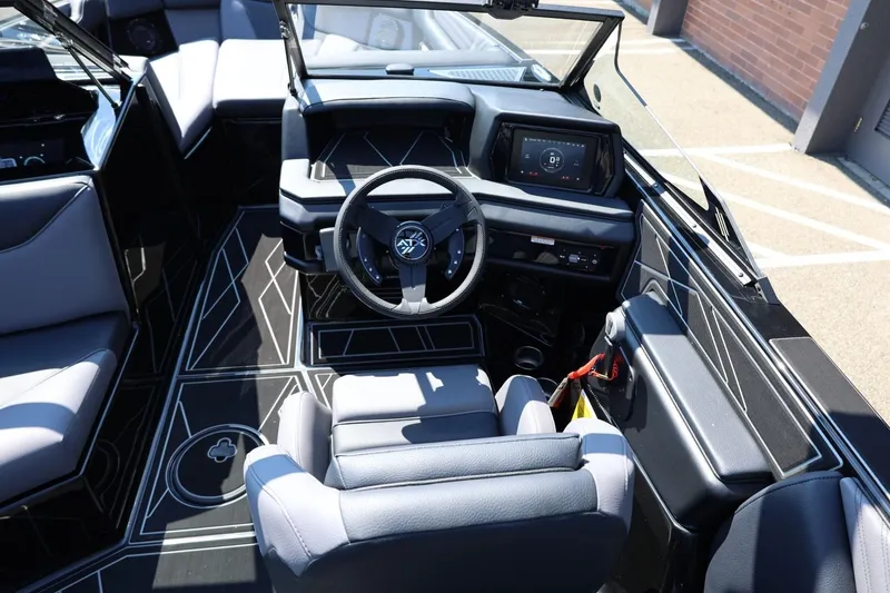 Slide: The Image of The image shows the cockpit of a 2027 ATX Surf Boats 22 Type-S with modern controls. - 38