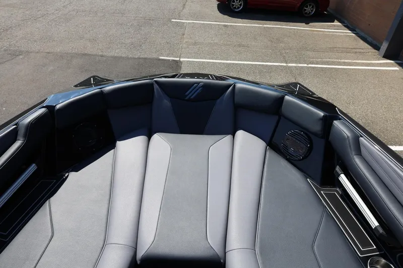 Slide: The Image of The image shows the bow area of a 2027 ATX Surf Boats 22 Type-S with gray upholstery. - 43