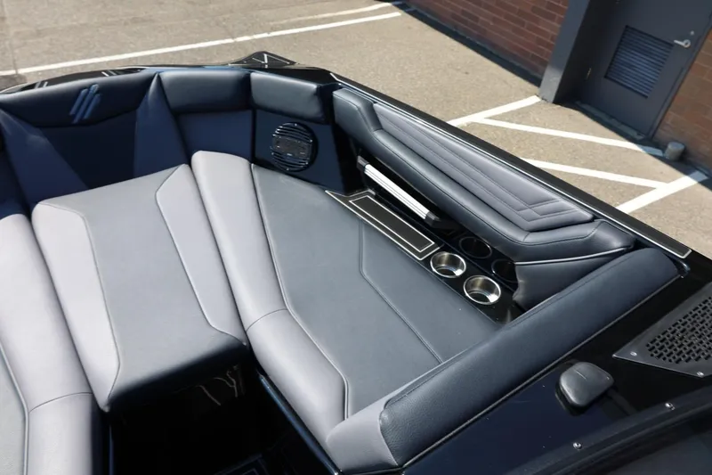 Slide: The Image of The image shows the stylish, cushioned interior of a 2027 ATX Surf Boats 22 Type-S. - 42