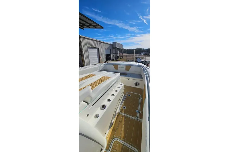 Slide: The Image of 2025 Insetta 35IFC boat interior with sleek design and modern features under a clear blue sky. - 6