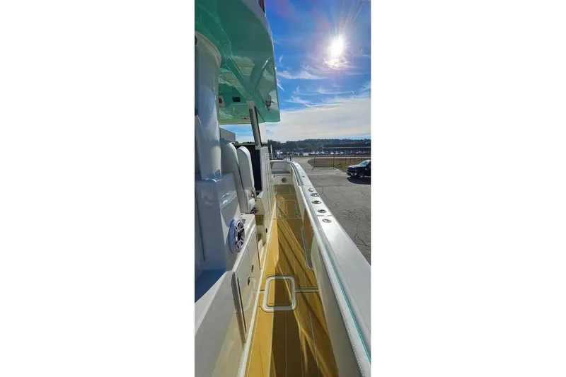 Slide: The Image of 2025 Insetta 35IFC boat deck under bright sun, showcasing sleek design and modern features. - 7