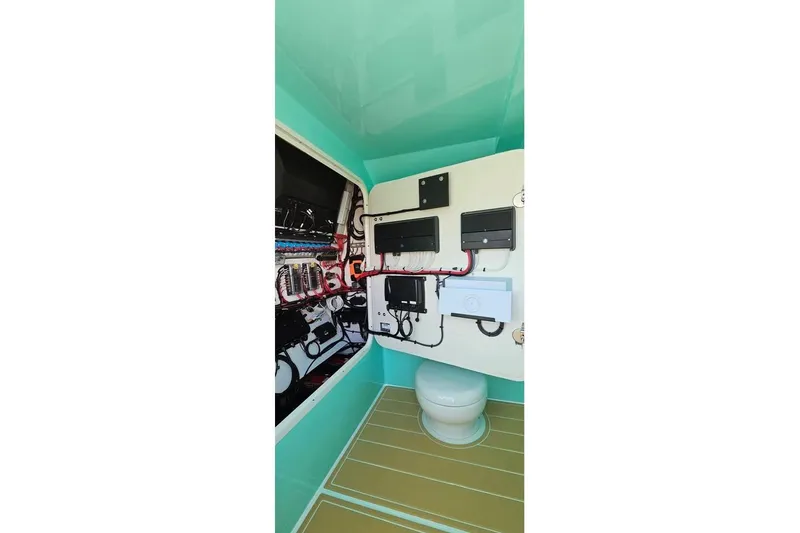 Slide: The Image of Interior of 2025 Insetta 35IFC boat, featuring control panels and wiring. - 11