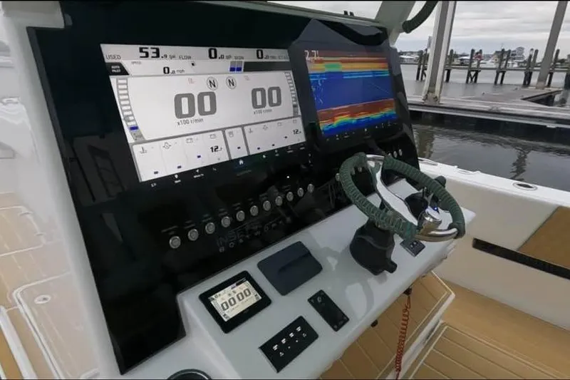 Slide: The Image of Control panel of 2025 Insetta 35IFC boat with advanced navigation displays. - 9