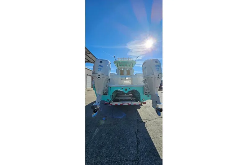 Slide: The Image of 2025 Insetta 35IFC boat with dual 350 V8 engines under bright sun. - 3