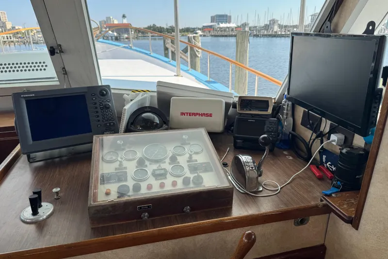 Slide: The Image of Control panel of a 1985 custom Bill Holland trawler with navigation equipment. - 18