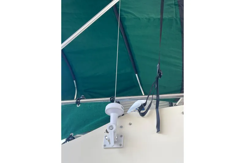 Slide: The Image of Green canopy and hardware on 1992 Camano Troll Sedan 31 boat. - 3