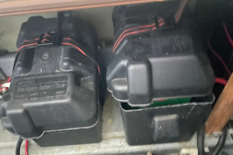 Slide: The Image of Two black battery boxes in a 1992 Camano Troll Sedan 31 boat. - 20