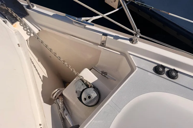 Slide: The Image of Anchor chain and winch on a 1997 Hunter 430 sailboat deck. - 21