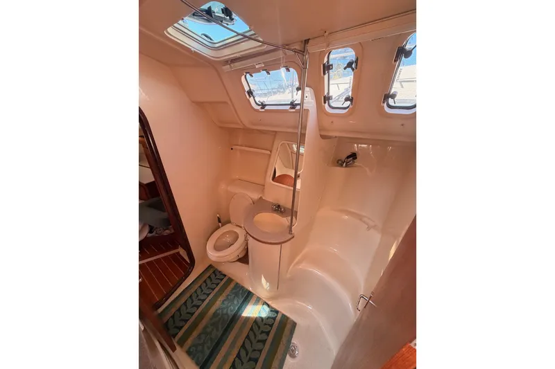 Slide: The Image of Bathroom interior of a 1997 Hunter 430 yacht with skylights and compact design. - 70