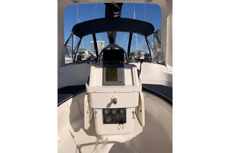 Slide: The Image of Cockpit view of a 1997 Hunter 430 sailboat with navigation equipment. - 10