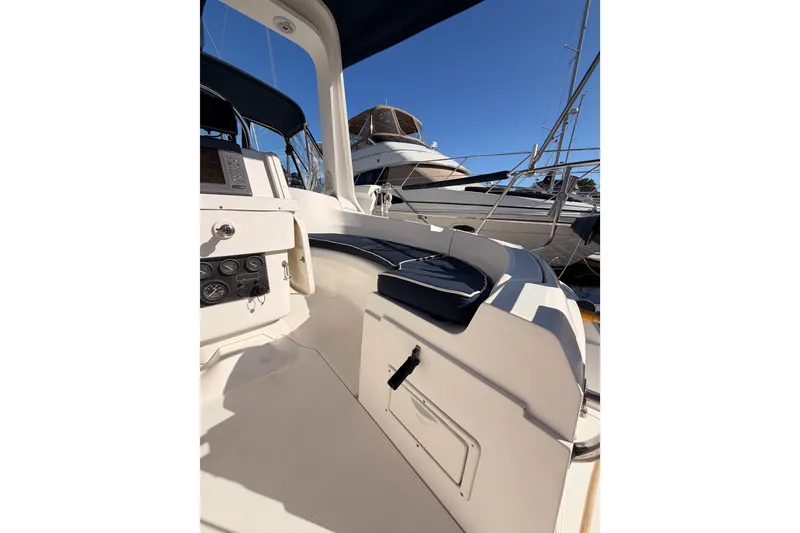 Slide: The Image of Cockpit view of a 1997 Hunter 430 sailboat, showcasing navigation instruments and seating. - 9