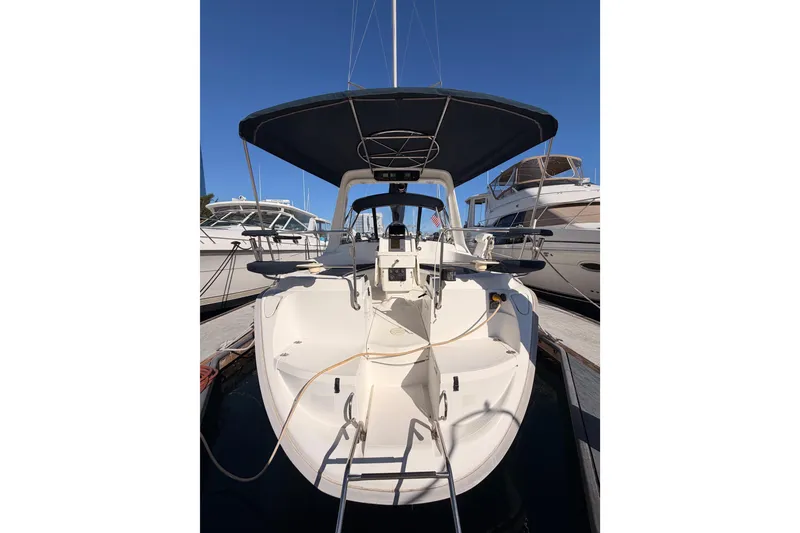 Slide: The Image of Sailboat Hunter 430, 1997 model, docked at marina under clear blue sky. - 6