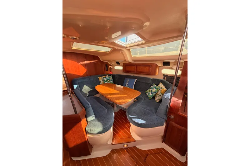 Slide: The Image of Interior of 1997 Hunter 430 yacht with cozy seating and wooden table. - 47