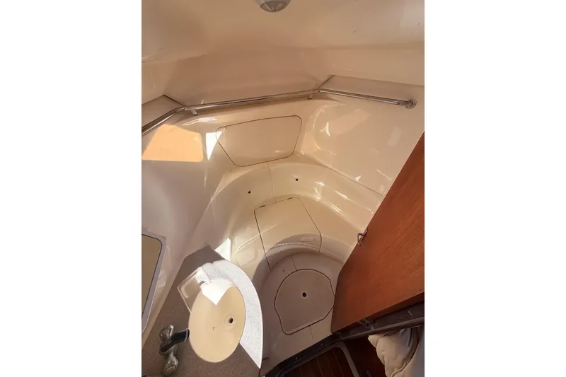 Slide: The Image of Interior of a 1997 Hunter 430 sailboat bathroom with sink and storage. - 58