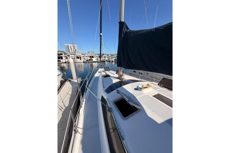Slide: The Image of Hunter 430 sailboat from 1997 docked at a marina under clear blue skies. - 18