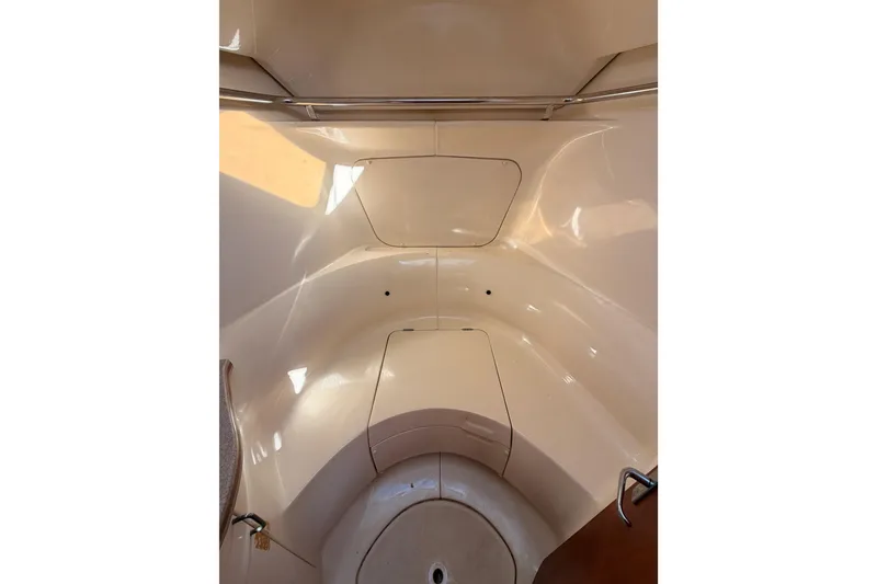 Slide: The Image of Interior view of a 1997 Hunter 430 sailboat cabin, featuring sleek, curved surfaces. - 59