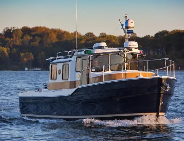 Slide: The Image of Manufacturer Provided Image: 2017 Ranger Tugs R-31 S cruising on a lake with autumn foliage in the background. - 77