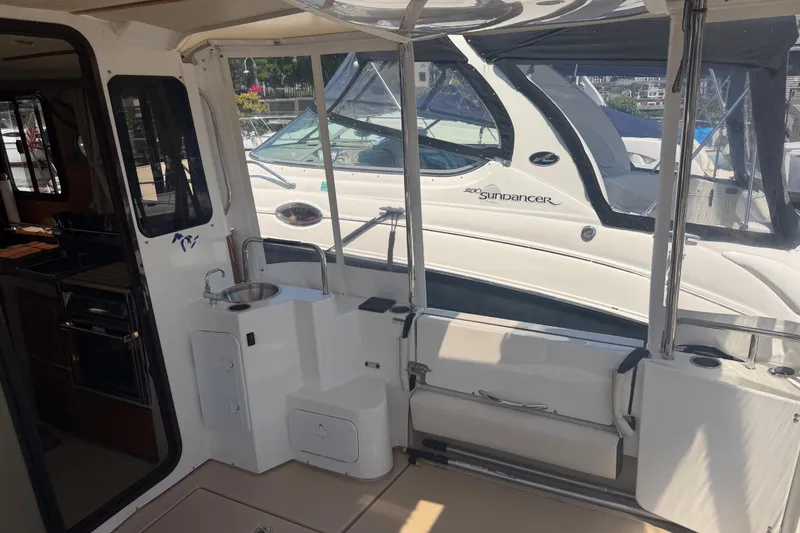 Slide: The Image of 2017 Ranger Tugs R-31 S boat interior with kitchenette and seating area. - 5